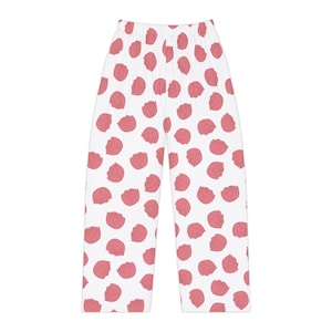 May include: White lounge pants featuring an all-over repeating pattern of pink rose buds. The pants have a straight-leg cut, a high-rise elasticized waistband, and a simple hemline, showcasing a consistent floral print across the entire garment.