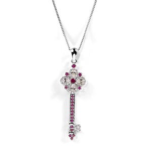 May include: A silver pendant necklace with a key-shaped design. The key's head is a flower shape, set with clear and red gemstones. The key's stem is also decorated with red gemstones. The necklace is suspended from a fine chain.