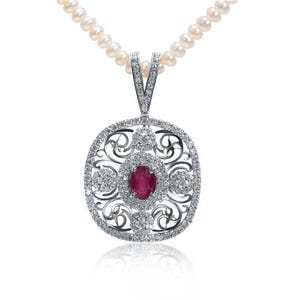 May include: A pendant necklace featuring a central oval ruby surrounded by a filigree design encrusted with small diamonds. The pendant hangs from a delicate strand of pearls, creating an elegant jewelry piece.
