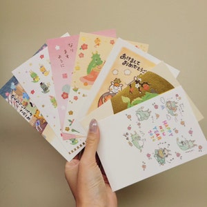 Cartoline dell'anno del drago giapponese, cartoline di capodanno giapponesi, biglietti d'auguri carini kawaii zodiacali Sanrio Hallmark