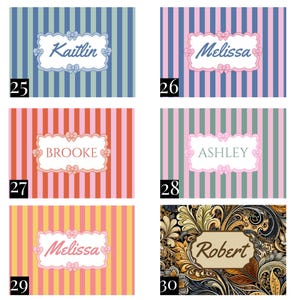 May include: A collection of six rectangular labels featuring various designs. Five labels have vertical stripes in blue, pink, orange, green, or yellow with a central white scalloped frame containing a name and small bow icons. One label has a dark floral pattern.
