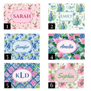 May include: Six rectangular personalised signs featuring distinct patterns: pink with martini glasses and mahjong tiles labelled SARAH, blue peacocks labelled EMILY, blue floral labelled Jennifer, pink flowers labelled Amelia, geometric tiles labelled KLD, and pink flowers labelled Sophia.