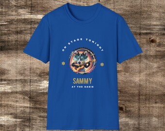 May include: A royal blue t-shirt with a graphic of a dog wearing sunglasses and playing a guitar. The graphic is surrounded by a circle with the text "On Stage Tonight" and stars. Below the graphic is the text "Sammy at the Oasis".