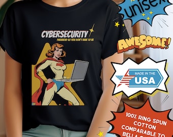 May include: Black t-shirt with a graphic of a superhero woman holding a laptop. The text "Cybersecurity Paranoid so you don't have to be" is printed on the shirt.