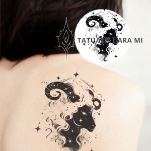 May include: Black and white tattoo design of a ram's head with stars and a galaxy-like pattern. The text "Tatuajes Para Mi" is visible in the background.