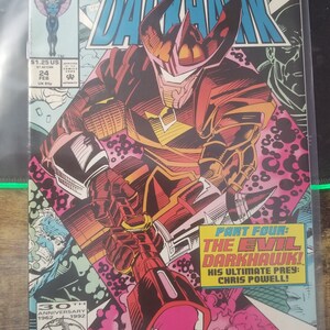 May include: A comic book cover featuring a red and black superhero character with a large, pointed helmet. The character is holding a large, glowing weapon. The cover text reads "Return to Forever! The Darkhawk Origin" and "Part Four: The Evil Darkhawk! His Ultimate Prey: Chris Powell!"