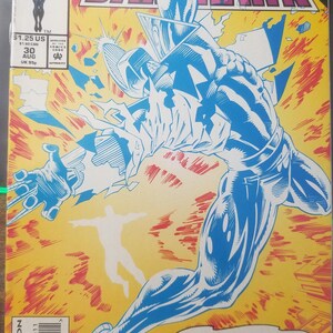 May include: A comic book cover featuring a blue and white superhero character with a yellow background. The title of the comic is "Darkhawk" and the text "Pureheart... The Ultimate Evil... Unleashed!" is featured on the cover.