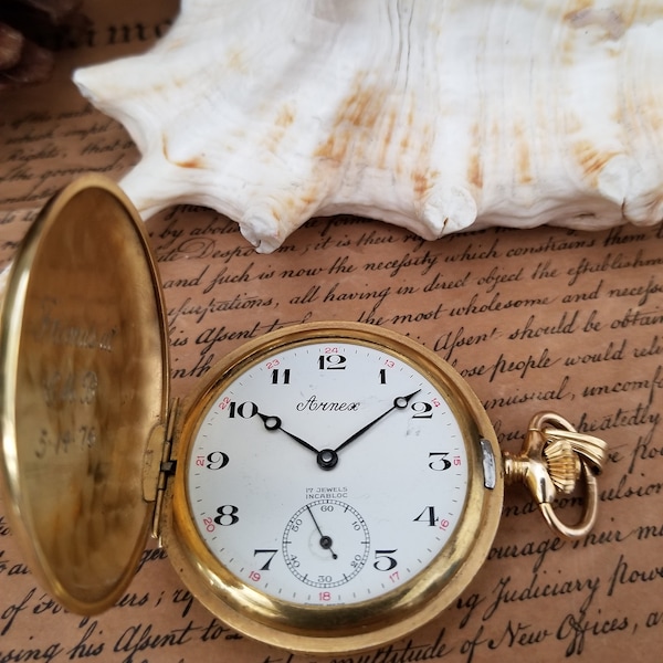 Armex 17 Jewels Incabloc Gold Tone Not Running Pocket Watch and The glass is missing.