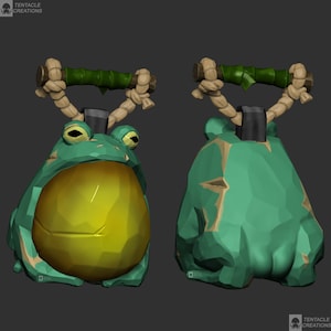 May include: A green frog-shaped ceramic bell with a yellow belly and a bamboo handle with rope accents. The bell is decorated with a textured surface.