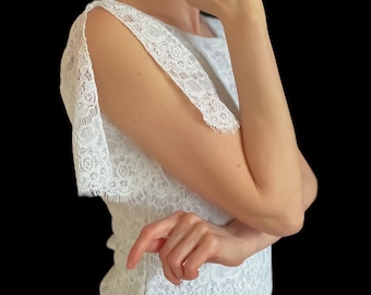 Haut de tango en jersey blanc double épaisseur avec fentes sur les manches.