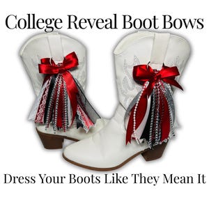 May include: Two white cowboy boots with red bows and decorative ribbons. The bows are attached to the top of the boots and have red, black, and white ribbons. The text "College Reveal Boot Bows" and "Dress Your Boots Like They Mean It" are displayed.