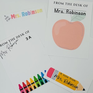 May include: Four different note cards with colorful designs. The cards feature a rainbow of crayons, a red apple, a pencil, and the text "A note from Mrs. Robinson".