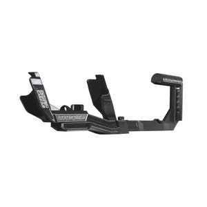 May include: A black, rigid, L-shaped camera cage component featuring a textured grip surface on the right side, multiple mounting points, and a structured frame design. This matte black accessory is constructed with a hollow, angular geometry.