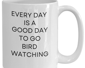 May include: White ceramic coffee mug with black text that reads "Every day is a good day to go bird watching".