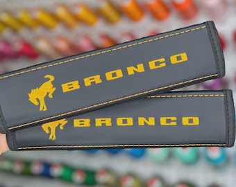 Bucking Bronco Cyber Orange Embroidered Vegan Leather Car Seat Belt Cover • Personalized Shoulder Pad