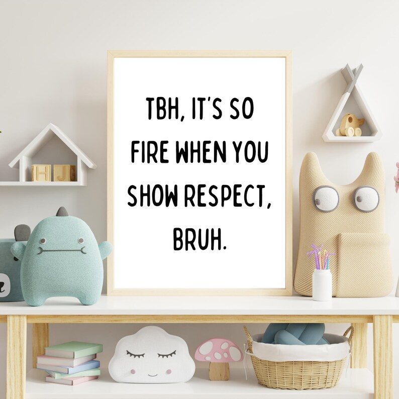 May include: A white framed print with black text that reads "TBH, it's so fire when you show respect, bruh." The print is on a shelf with a wooden toy house, a blue plush toy, a tan plush toy with large eyes, and a white cloud-shaped plush toy.