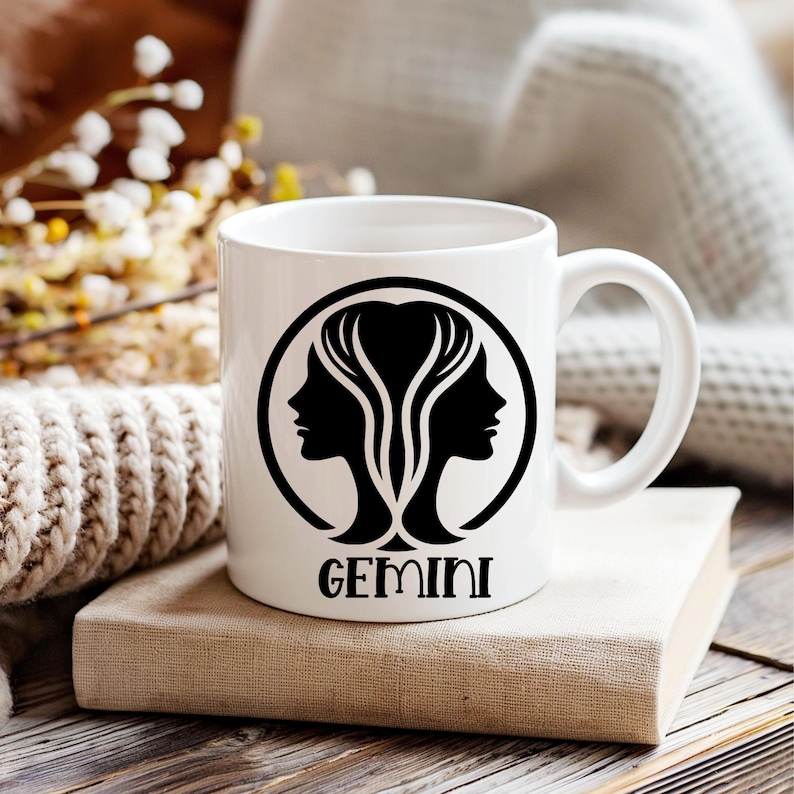May include: White ceramic mug with a black silhouette of two female heads with the word "GEMINI" printed below.
