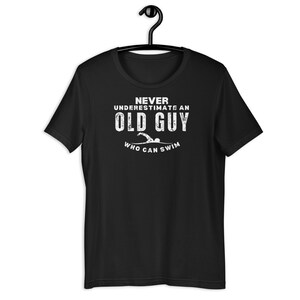 Old Guy Swimmer T-Shirt – Never Underestimate a Man Who Can Swim Tee, Swim Dad Gift, Coach Shirt, Masters Swimming Humor Top for Men. swim humor shirt
competitive swimmer tee
coach appreciation shirt
still fast swim shirt
funny men’s swimmer tee
