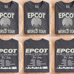 six gray t-shirts with the same design, featuring the text "EPCOT WORLD TOUR" and a graphic of the EPCOT World Showcase.