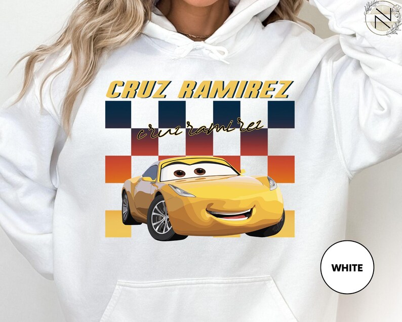 A white hoodie with a graphic of a yellow car and the text "CRUZ RAMIREZ" printed on it.
