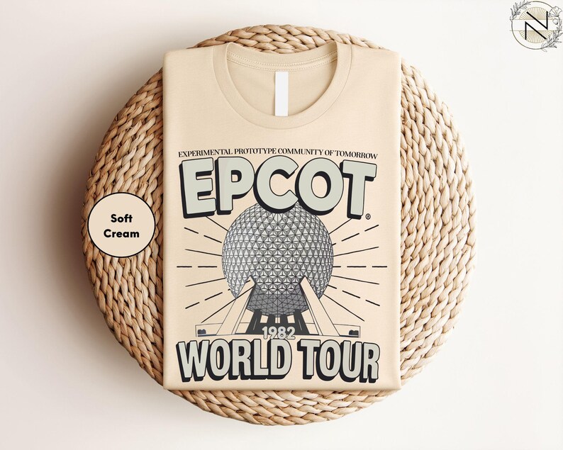 a beige t-shirt with a graphic design depicting the EPCOT World Tour from 1982.