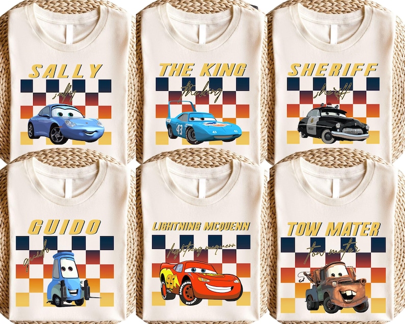 six white t-shirts with various cartoon car designs and text printed on them.