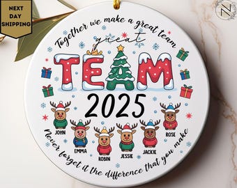 May include: A white ceramic Christmas ornament with the text "TEAM 2025" in red and green, surrounded by reindeer and gift illustrations. The ornament includes the phrase "Together we make a great team."