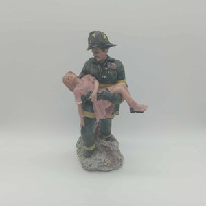 F.D.N.Y Fireman rescue girl ceramic statue 11 inches tall