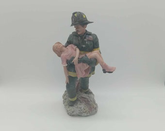 F.D.N.Y Fireman rescue girl ceramic statue 11 inches tall