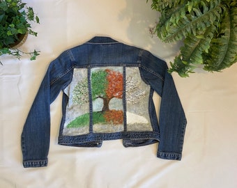 Reimagined denim jacket with four seasons tree painting on back.