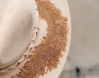 Cream hat with burned feather design