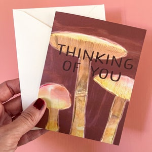 Thinking of You card with mushroom art on a burgundy background