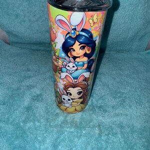 May include: A white ceramic mug with a black handle and the text "But First, Coffee" in a bold, black font. The mug is set against a neutral background, highlighting its simple design.