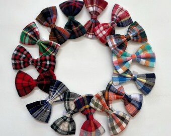 May include: A set of 12 plaid bow ties in various colors and patterns, arranged in a circle on a white background.