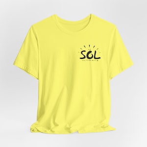 May include: A yellow t-shirt with a black graphic that says "SOL ULTIMATE" with a sunburst design.