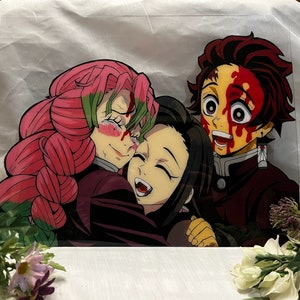 May include: A colorful anime illustration of three characters. The characters are a woman with pink hair, a woman with black hair, and a man with red hair. The man has blood on his face and is smiling. The women are hugging each other.