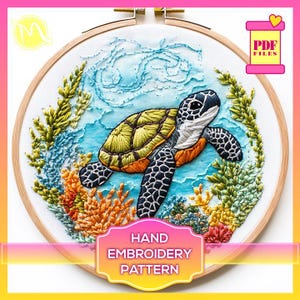 May include: Hand embroidery pattern featuring a sea turtle swimming in a blue ocean with coral reefs and seaweed. The pattern is in a wooden embroidery hoop.