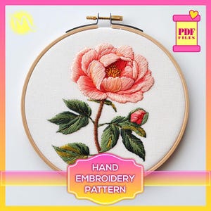 May include: A hand embroidery pattern featuring a pink peony flower with green leaves. The pattern is displayed in a wooden embroidery hoop. The text "HAND EMBROIDERY PATTERN" is printed below the hoop.