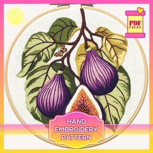May include: Hand embroidery pattern featuring a branch of fig leaves and three figs, one with a purple hue and two with a purple and orange hue. The pattern is displayed in a wooden embroidery hoop.