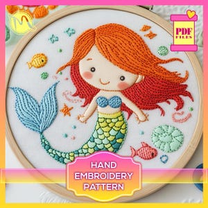 May include: A hand embroidery pattern featuring a mermaid with red hair, a blue tail, and a green seashell top. The pattern is surrounded by stars, seashells, and fish.