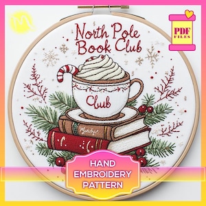 May include: Hand embroidery pattern for a cozy winter scene featuring a cup of hot chocolate with whipped cream and a candy cane, a stack of books, and a sprig of holly. The text "North Pole Book Club" is embroidered above the cup.