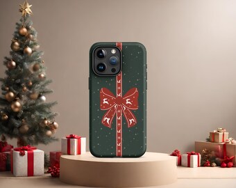 May include: A green phone case with a red bow and white snowflakes. The case has a festive Christmas design.
