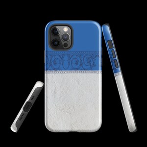 May include: A blue and white phone case with a decorative pattern. The case has a textured white background and a blue band with a decorative pattern. The case is designed for a phone with a triple camera system.