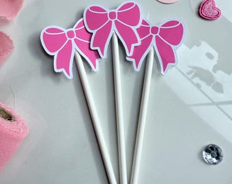 Roze cupcaketoppers met flirtstrik