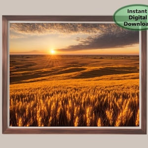 May include: A framed print of a golden wheat field at sunset. The sun is setting on the horizon, casting long shadows across the field. The sky is a mix of orange, yellow, and blue. Text on the image says "Instant Digital Download".