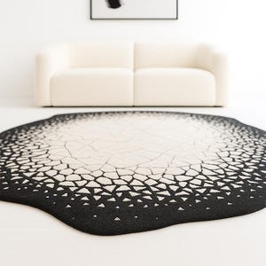 Wide interior view featuring minimalist décor styled with modern abstract eclipse rug.