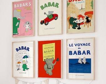 May include: A set of six framed prints featuring illustrations of Babar the Elephant. The prints are in various colours and feature different scenes from the Babar stories. The prints are all in French.