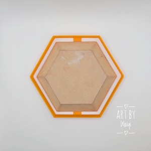 May include: A hexagonal tray with a white inner rim and an orange outer rim. The tray is made of wood and has a smooth, light brown surface. The text "ART BY Waiyi" is written in white on a black background below the tray.