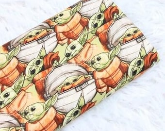 Tessuto di cotone Star Wars Grogu in vendita a mezzo metro