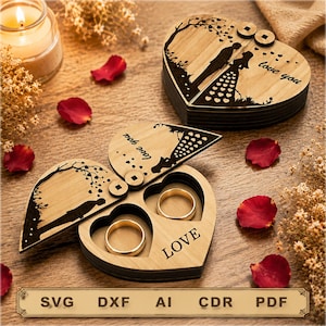 May include: Two heart-shaped wooden ring boxes with laser-engraved silhouettes of a couple and the text "love you" and "LOVE". One box is closed, while the other is open, revealing two circular cutouts designed to hold rings securely inside.